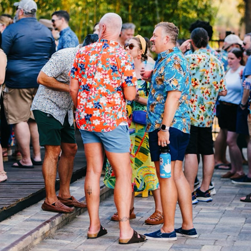 men in colorful shirts laugh